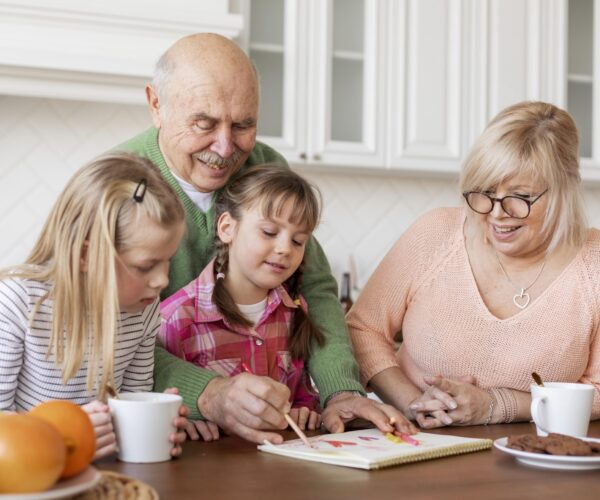 medium-shot-grandparents-girls-indoors #image_title